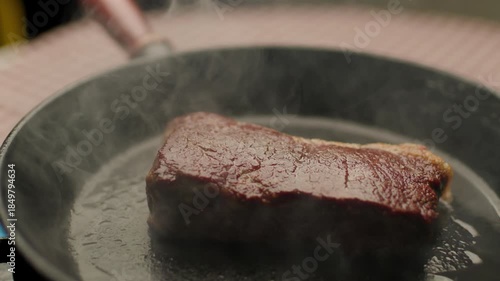 Beef Steak Roasting on Frying Pan, Close Up