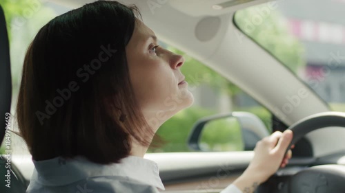 Woman Driving a Car in the City, Close Up Shot