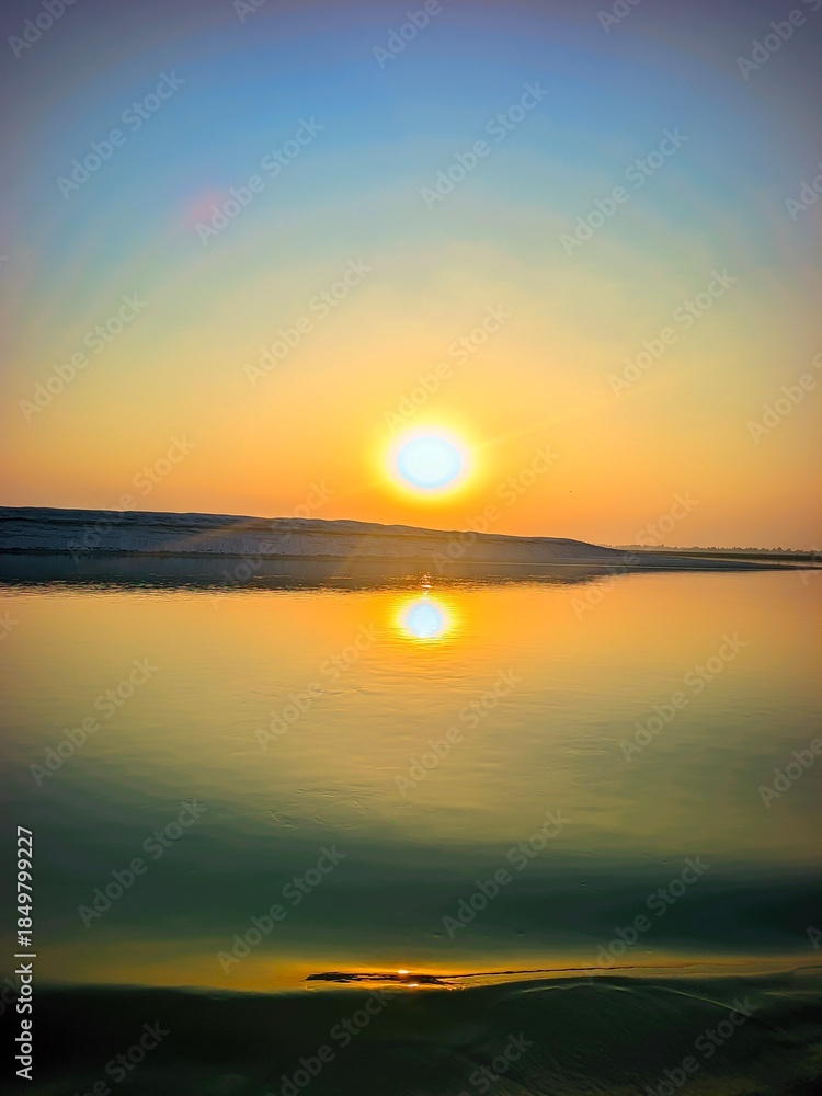 Obraz premium Tranquil Nature Background With Sunset and Smooth Water 