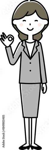 OKサインを出すスーツの女性