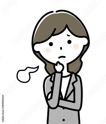 ため息をつくスーツの女性