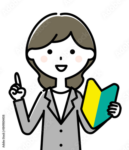 初心者マークを持つスーツの女性

