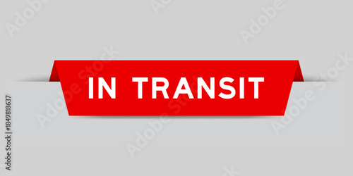 Red color inserted label with word in transit on gray background