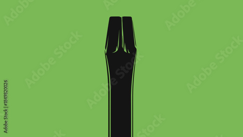 Black Plastic Fork on Green Background.