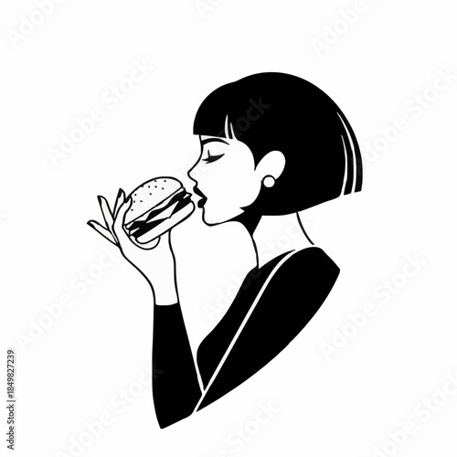 young stylish woman eats a burger