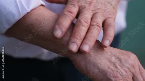An intimate close-up of two hands showcasing the signs of age and experience, inviting viewers to reflect on life's journey and the stories etched in their skin, fa01