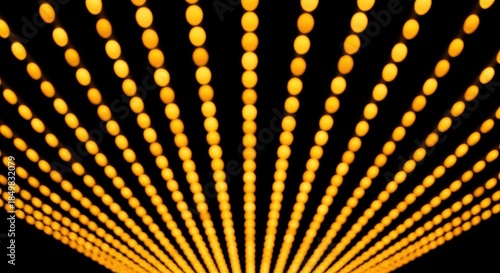 Abstract background of bright golden bokeh lights creating a dynamic sense of perspective and depth.