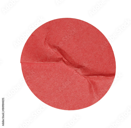 Red crumpled paper circle label with wrinkles and folds, a textured mockups element for design sticker