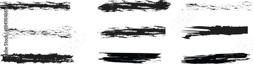 Collection of black brush strokes and smudges on white background