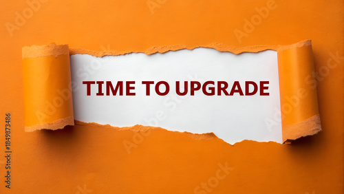 Torn orange paper revealing white background with red text message time to upgrade concept