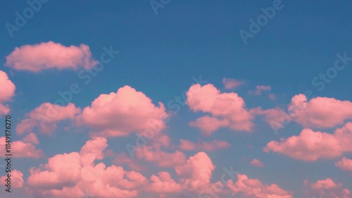 Beautiful Cumulus Cotton Orange Peach Clouds Open Blue Sky At Sunset, Time Lapse. Soaring Colorful Clouds 4K in the Pure Blue Sky at Dawn, Slow Motion, Skyscrapers, Firmament, Atmosphere.