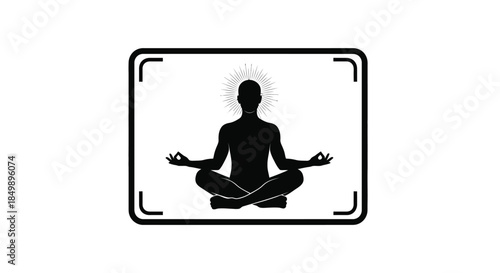 Silhouette of a person meditating in lotus position with halo representing spiritual enlightenment and focus