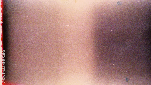Blank grained film strip texture background with heavy grain, dust and light leak.