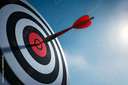 Red dart hitting the center of target
