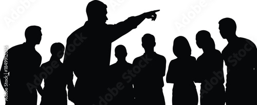 Silhouette of a commanding leader pointing forward while addressing a diverse group of attentive team members against a bright white background
