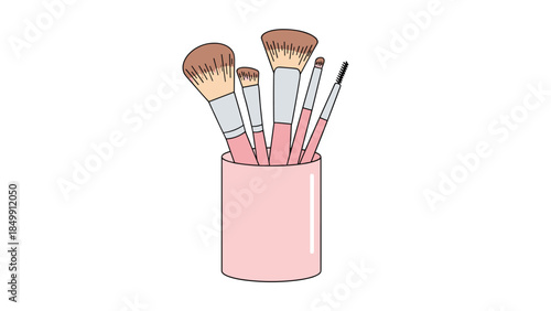 A collection of makeup brushes stands neatly organized in a pink cylindrical holder, perfect for beauty routines.