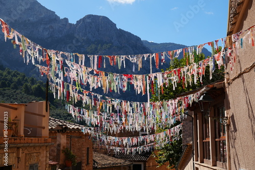 Colorful pennants in alley