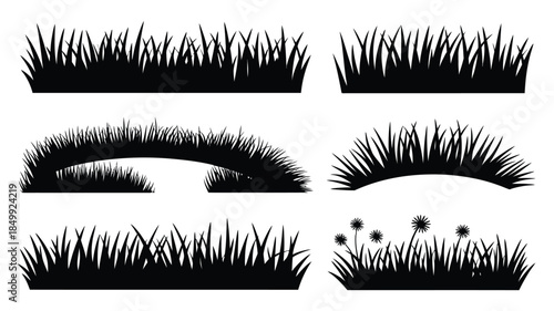 Several black silhouettes of grass patches and dandelion weeds displayed