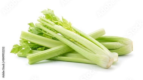 Fresh crisp celery stalks with vibrant green leaves piled together isolated on a clean white background ready for healthy cooking or snacking