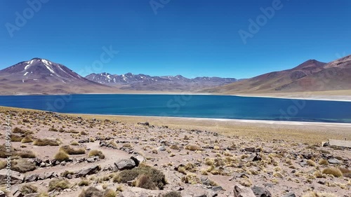 San Pedro de Atacama, Chile: Panorama footage of Lagunas Miscanti,  blue water lake near San Pedro de Atacama, Chile with Miñiques volcano in the background in south America on the Altiplano