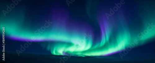 Aurora are delicate, undulating bands of green-violet light, pulsating atmospherically and mystically over the dark horizon. It is suitable for natural backgrounds, album covers.