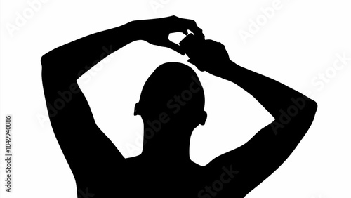 Silhouette of a person forming a heart with their hands