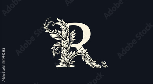 Ornate letter r is intricately embellished with classic floral engravings on a dark navy background for luxury branding and monogram use.