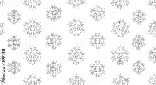 Seamless pattern featuring multiple intricate black and white snowflake designs arranged on a clean white background for winter.