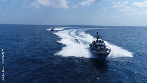 Fotografia Israeli Navy Missile Boats High Speed

Aerial view of Israeli Navy Saar class missile boats sailing at high speed across open sea, Israel, November 2025