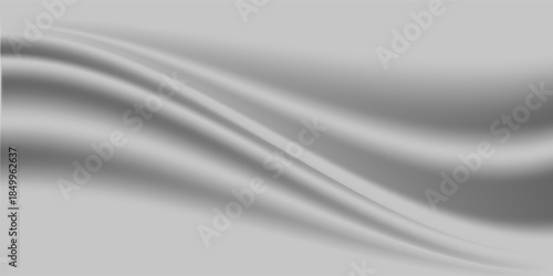 Silver foil background with a metallic mirror texture. Chrome gradient surface with a slight sheen. Gray aluminum sheet with reflections. Abstract cool background of platinum and titanium.