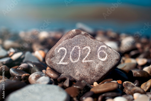 The year 2026 etched on a rock by the ocean