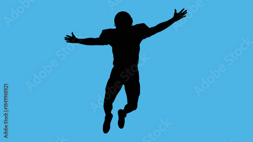 Happy Male Athlete Silhouette Jumping with Arms Spread on Blue Background, Celebrating Success