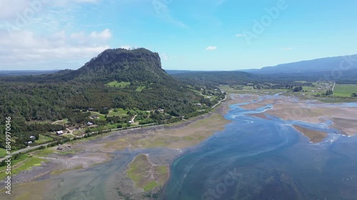 Hualaihue, Chile: Aerial drone footage of Hualaihue, rural area in Lake district of Chile with mountain in the background near Hornopiren. Taken with forward motion