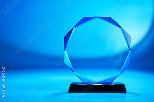 crystal trophy against blue backgroound