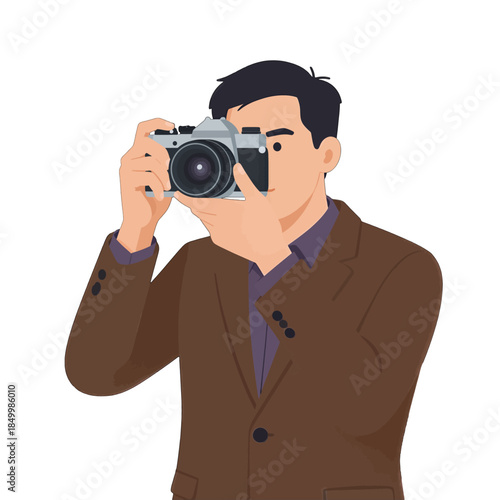 Man in brown suit holding camera