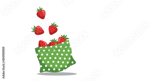 Zero waste concept with fresh strawberries falling into a green polka dot reusable fabric bag isolated on a white background.