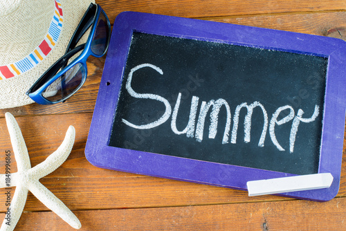 The word Summer 2026 written on a chalkboard.