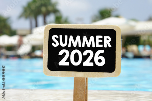 The word Summer 2026 written on a chalkboard.