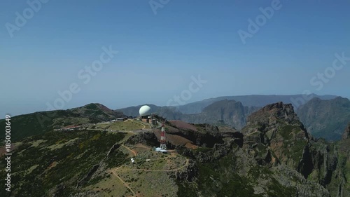 Paraglider Preparing for Flight on Mountain Peak with Scenic Landscape.