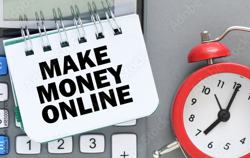 MAKE MONEY ONLINE lettering written on notepad. Business concept.