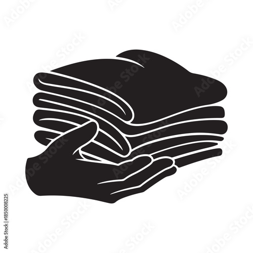 A black and white illustration of folded clothes held by a hand