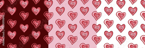 A cute set of three different color variations of hand-drawn seamless patterns with pink and red hearts. Valentine's Day vector backgrounds.