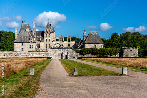 Frontal view of Château de Kerjean in Brittany, showcasing its Renaissance stone façade, towers, and historic architectural details under natural light.

