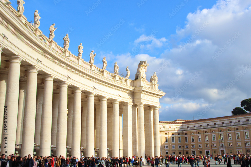 Naklejka premium St. Peter's Square Vatican City Colonnade with Statues and Tourists
