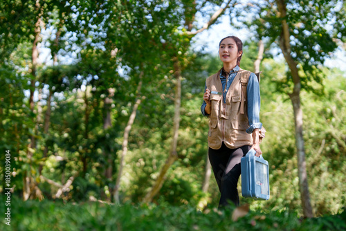 Asian Botanist Exploring Forest Wilderness Conducting Plant Research Discovering Biodiversity Natural Habitat Environment