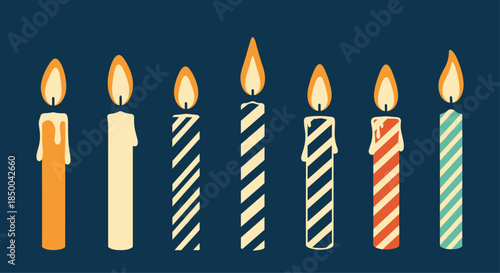 Collection of seven diverse birthday candles with different patterns, colors, and drips, all lit and arranged on a dark blue background.