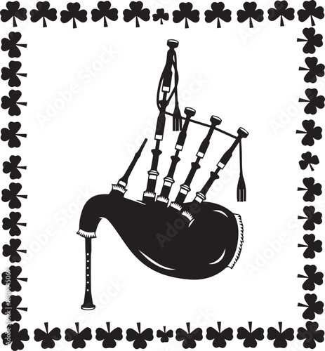 Black silhouette of bagpipes surrounded by a shamrock border