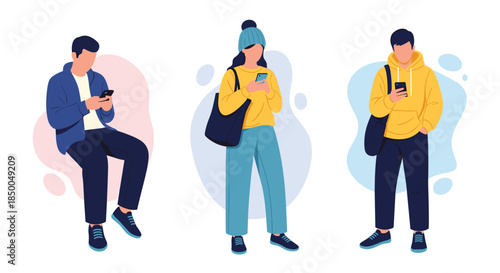 Set of three young people a man sitting and two others standing dressed in casual clothes all engrossed in using their smartphones.