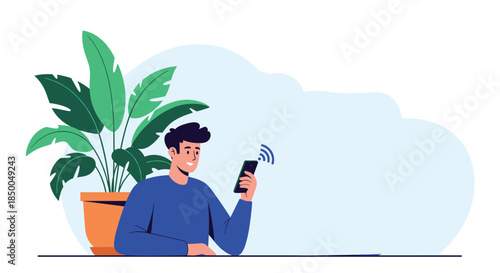 Happy young man sitting at a table and using his smartphone with a wifi signal indicating a strong internet connection at home.