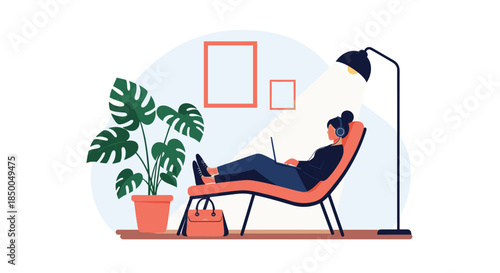 Woman relaxing in a comfortable lounge chair working or streaming on her laptop with headphones in a cozy home interior.